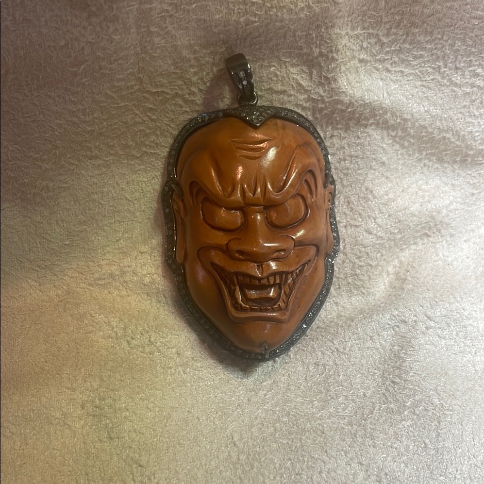 Carved Face Pendant With Silver & Diamond Accents